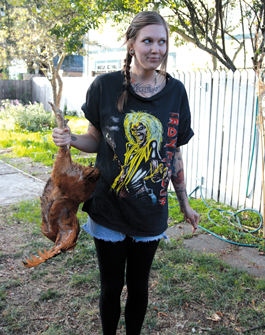 women slaughting chicken